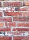 Fragment of an old historic red brick wall with white cement seams as a background or texture Royalty Free Stock Photo