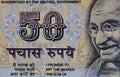 Fragment of old 50 Indian rupee obverse