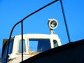 A fragment of an old rusty boat with a lantern . Royalty Free Stock Photo