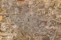 Fragment of old stone wall. Multicolored large cobbles. Old medieval castle stone wall texture background. Royalty Free Stock Photo