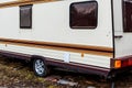 Fragment of an old trailer, a mobile home. Space for lettering or design Royalty Free Stock Photo