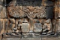 Fragment of old wall with ancient bas-reliefs of the Borobudur Temple. Indonesia.