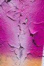 Fragment of an old wall with fuchsia, orange and light paints. Peeling of paint. Space for text Royalty Free Stock Photo