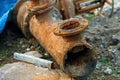 Fragment of an old water pipe close up. After years of use, a rusted metal pipe was dug out of the ground. Rusty metal. Royalty Free Stock Photo