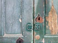 Fragment of old wooden door with keyhole and door lock close-up Royalty Free Stock Photo