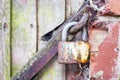 Fragment of an old wooden door with a lock