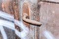 Detail of an old wooden door with rusty handle Royalty Free Stock Photo