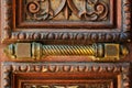 Fragment of old wooden door with rusty handle Royalty Free Stock Photo