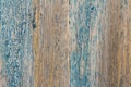 A fragment of an old wooden fence with remnants of blue paint, close-up Royalty Free Stock Photo