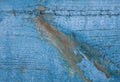 Fragment of the old wooden plank with peeling paint, macro