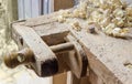 Fragment of old woodworking workbench with fixing devices of workpieces Royalty Free Stock Photo