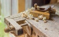 Fragment of old woodworking workbench with two wooden hand plane Royalty Free Stock Photo