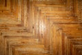 fragment of an old worn wood parquet. Old worn flooring. Oak flooring.