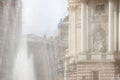 A fragment of the opera house in the rays of sunlight and splashes of a fountain. Romance and beauty of an ancient city. Lviv town Royalty Free Stock Photo