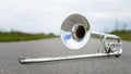 Fragment outdoor lying trombone closeup Royalty Free Stock Photo