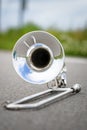 Fragment outdoor lying trombone closeup Royalty Free Stock Photo