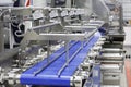 A fragment of the packaging system. Conveyor belt at a food factory