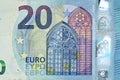 Fragment part of 20 euro banknote close-up with small blue details