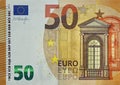 Fragment part of 50 euro banknote close-up with small brown details