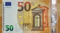 Fragment part of 50 euro banknote close-up with small brown details