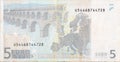 Fragment part of 5 euro banknote close-up with small brown details