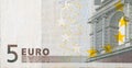 Fragment part of 5 euro banknote close-up with small brown details