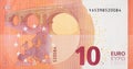 Fragment part of 10 euro banknote close-up with small red details