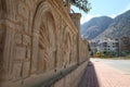 A fragment of patterned stone wall in sunny summer day Royalty Free Stock Photo