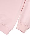 Fragment of pink cotton sweatshirt with long sleeves closeup, fabric of sleeves and elastic band, mockup