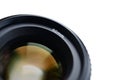 Fragment of a portrait lens for a modern SLR camera. A photograph of a wide-aperture lens with a focal length of 50mm isolated on Royalty Free Stock Photo