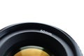 Fragment of a portrait lens for a modern SLR camera. A photograph of a wide-aperture lens with a focal length of 50mm isolated on Royalty Free Stock Photo