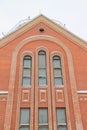 Fragment of a red brick church with windows Royalty Free Stock Photo