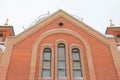 Fragment of a red brick church with windows Royalty Free Stock Photo