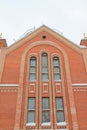 Fragment of a red brick church with windows Royalty Free Stock Photo