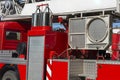 Fragment of a red fire engine. Fire technological transport. Fire engines are preparing for fire fighting Royalty Free Stock Photo