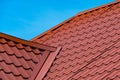 Fragment of red metal tile roof Royalty Free Stock Photo