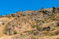 Rock ledges on the mountainside as a natural background. Royalty Free Stock Photo