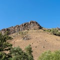 A rock in the mountains of Armenia with an interesting vertical stone structure. Royalty Free Stock Photo