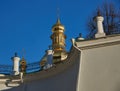 Fragment of the retaining wall of the Kiev Pechersk Lavra. Behind the wall you can see the golden domes of the Orthodox church Royalty Free Stock Photo