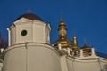 Fragment of the retaining wall of the Kiev Pechersk Lavra. Behind the wall you can see the golden domes of the Orthodox church Royalty Free Stock Photo