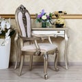 A fragment of a retro interior with a chair and a desk on which is located a telephone and a vase of flowers Royalty Free Stock Photo