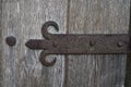 Fragment of a rusty door hinge. Background. Royalty Free Stock Photo