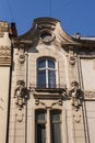 Fragment of a secession house in Lviv, Ukraine. Art Nouveau window and mascarons in the shape of women`s faces Royalty Free Stock Photo