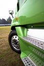 Fragment of semi truck green modern model side view Royalty Free Stock Photo