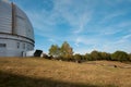 Fragment of silver spherical cup of the Astrophysical Observatory on the background of mountainous nature.