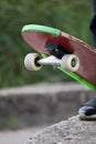 Fragment of a skateboard on the background of a pond.