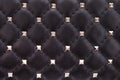 Fragment of black leather with metal spikes Royalty Free Stock Photo
