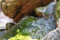 Fragment of a small decorative artificial waterfall Royalty Free Stock Photo