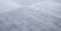 Fragment of the square paved of a large granite tiles Royalty Free Stock Photo