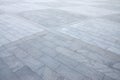 Fragment of the square paved of a large granite tiles Royalty Free Stock Photo